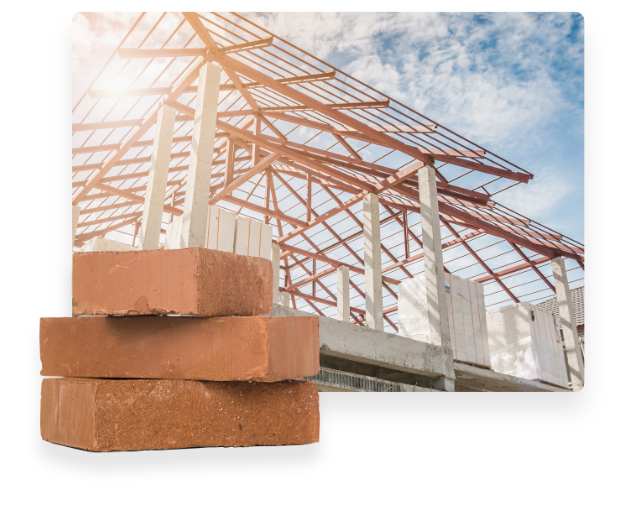 mattoni e edificio in costruzione: assicurazione impresa edile